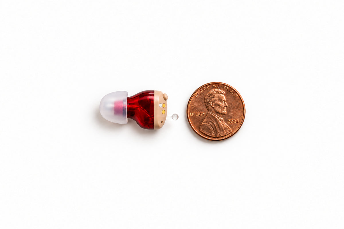 One Oricle Pro aid beside a US penny