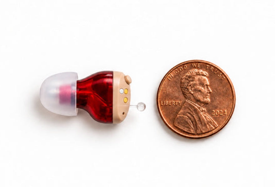 One Oricle Pro aid beside a US penny